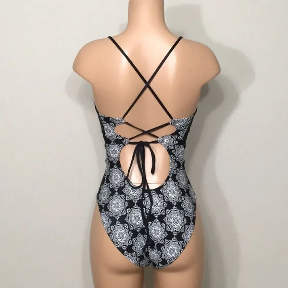 Medallion print plunge swimsuit. RUNS SMALL. NWOT